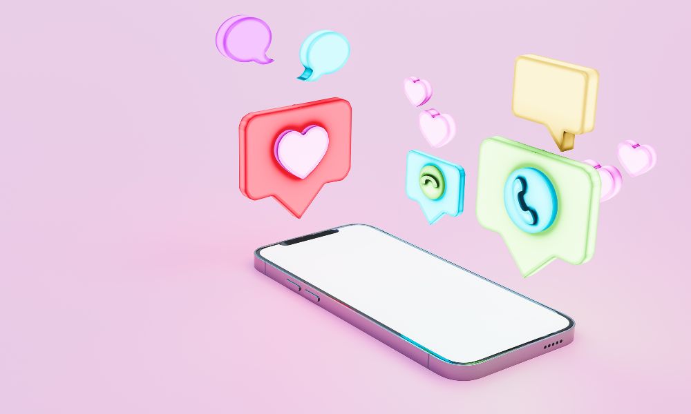 Neon coloured social symbols hover above a phone graphic. Set against a pink background