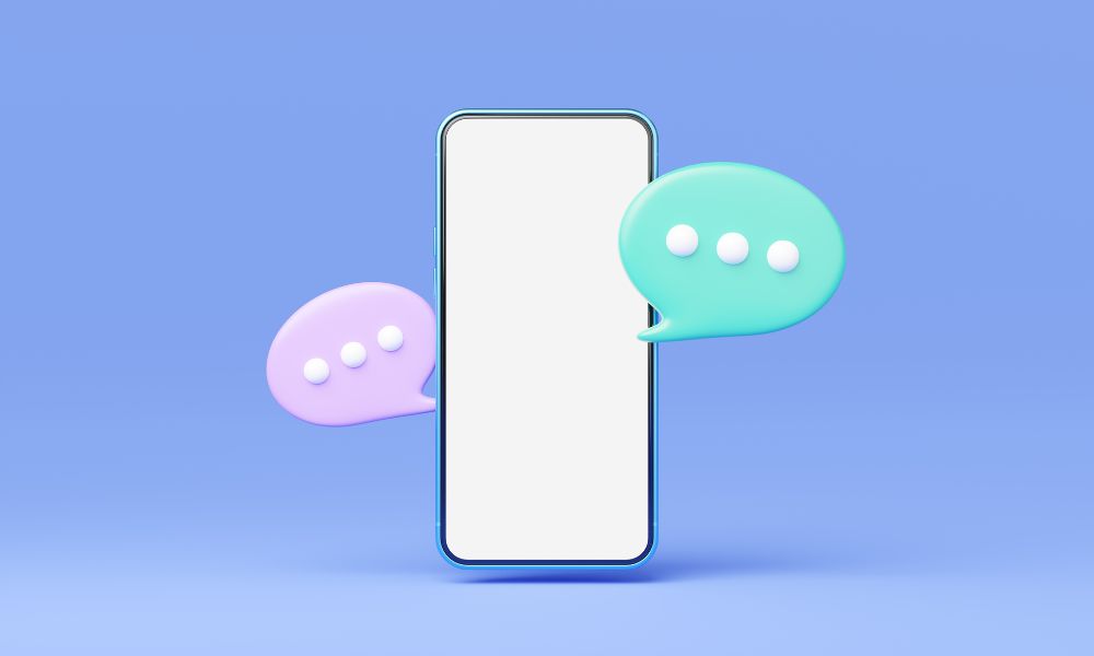 A phone on a pale blue background, it is surrounded by green and pink speech bubbles. For Blog LinkedIn Marketing